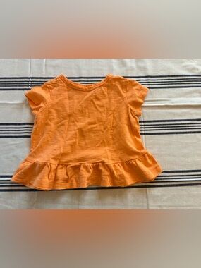 Primary Orange Ruffle Hem Tee